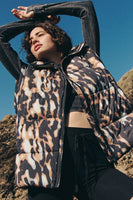 Free People Movement Printed in a Bubble Vest Style OB1497623 in Tortoise Shell and in Chevron Camper; Insulated Puffer Vest;  Free People Movement Puffer Vest